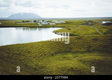 The coastline around the pond Stakholstjorn with pseudo craters - natural monument near Lake Myvatn in Northern Iceland in summer Stock Photo