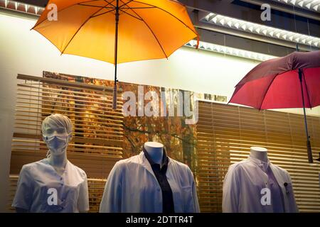 mannequins in a window of a shop for workwear in the old part of the town, Cologne, Germany.  Schaufensterpuppen eines Geschaefts fuer Berufskleidung Stock Photo