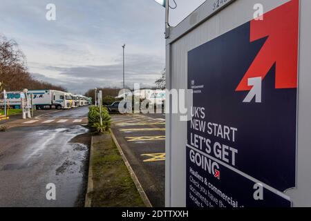 London, UK. 22nd Dec, 2020. UK Governent boothes proclaim a 'New Start' and 'Lets get Going' as they attempt to give out advice on the Brexit changes looming. They are not well attended as drivers have more imminent problems on their minds. Lorries are parked up on both sides of the M2 services (about 30 miles from Dover) while awaiting clearance to go to the port. The M20 is closed as a result of the build up of HGV traffic in Kent after much of the South east of England goes in to Tier 4 and the French close their ferry border. Credit: Guy Bell/Alamy Live News Stock Photo