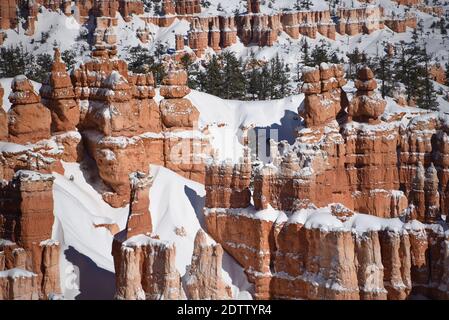 The hoodoos of beautifully colorful snow covered Bryce Canyon National Park, Utah, USA. Stock Photo