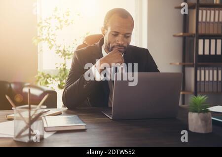 Close-up portrait of his he nice attractive classy focused busy guy skilled experienced specialist finance expert using laptop consulting client Stock Photo