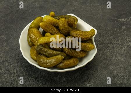 Pickled young gherkin in the bowl Stock Photo