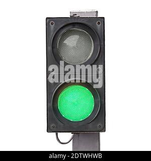 Two-color traffic light with green light on it. Isolated on white, clipping path included Stock Photo