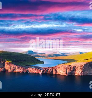 Aerial view from drone of Sorvagsvatn lake on cliffs of Vagar island in sunset time, Faroe Islands, Denmark. Landscape photography Stock Photo