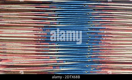 Abstract side view of stacked flat cardboard boxes makes for interesting texture aesthetic, background, wallpaper, space for copy, text Stock Photo