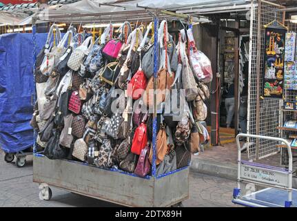 falce Louis Vuitton woman handbags before a shop, Chinatown district,  Kuala Lumpur,  Malaysia Stock Photo