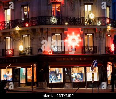 Hermes at dusk with Christmas lights on avenue George V - Paris, France Stock Photo