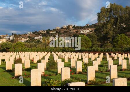 Rows of headstones in Souda Bay War Cemetery at sunrise, Chania region, Crete Island, Greece Stock Photo