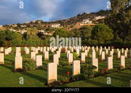 Rows of headstones in Souda Bay War Cemetery at sunrise, Chania region, Crete Island, Greece Stock Photo