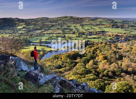 Walker looking out over Teggs Nose & Bottoms Reservoirs from Tegg’s Nose, near Macclesfield, Cheshire, England, UK Stock Photo