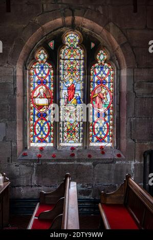 Remembrance Window with Poppies in St Michaels Church, Marbury, Cheshire, England, UK Stock Photo