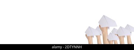The hands throw upwards messages in the manner of paper airplanes. Stock Photo