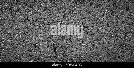 Gray new asphalt texture. Bright and panoramic image of road background. Tar detail. Graphic resource Stock Photo