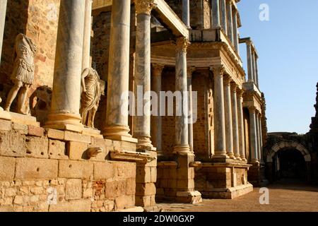 Roman ruins at the Roman open air theatre in strong sunlight against deep blue sky Merida Spain April 2014 Stock Photo