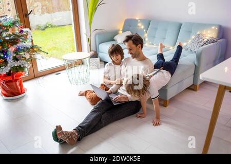 Father trying to work from home with his kids Stock Photo