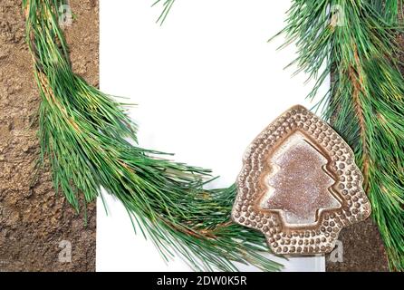 White paper with pine branches and shiny Christmas tree. Copy spase Stock Photo