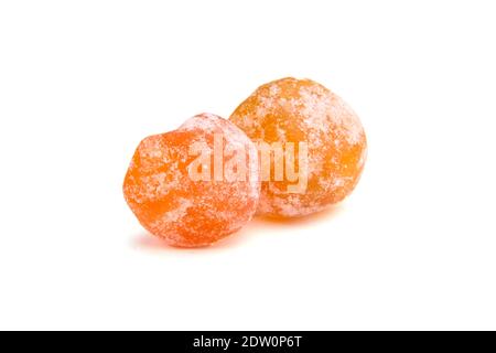 Dried kumquats, two candied fruits isolated on white background. Sugar coated kumquats Stock Photo