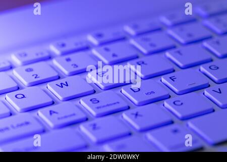 Blue highlighted qwerty keys on a computer keyboard Stock Photo
