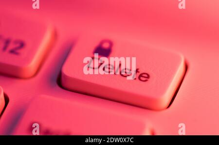 Close up detail of a red highlighted delete key on a computer keyboard Stock Photo