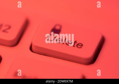 Close up detail of a red highlighted delete key on a computer keyboard Stock Photo