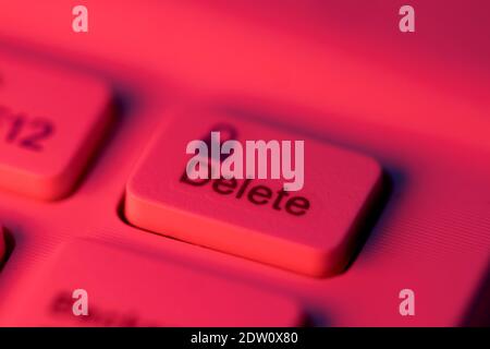 Close up detail of a red highlighted delete key on a computer keyboard Stock Photo