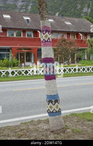The main road into town is lined with knit/crochet trees. The knitting concept has a broad symbolic meaning. Stock Photo
