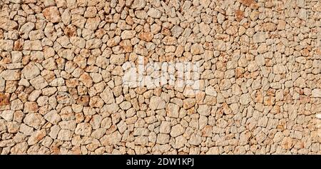panoramic texture stone wall , sandstone, limestone surface. Close image. Stone, natural abstract texture for backgrounds. Close up, architecture. Stock Photo