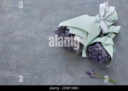 Lavender flower bouquets on gray background. Copy space for text. Stock Photo