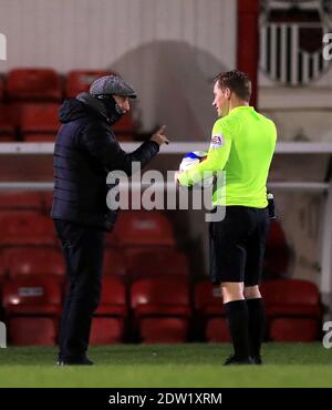 Grimsby Town manager Ian Holloway speaks to Referee John Busby during the Sky Bet League Two match at Blundell Park, Grimsby. Stock Photo