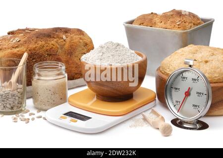https://l450v.alamy.com/450v/2dw232k/homemade-sourdough-bread-natural-leaven-for-bread-in-a-glass-jar-wooden-bowl-of-dough-kitchen-scale-a-bowl-of-flour-and-oven-thermometer-on-white-2dw232k.jpg