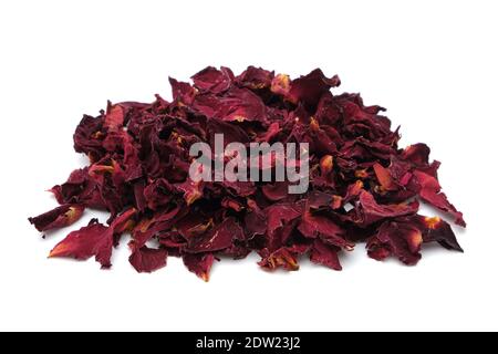 Pile of dried healthy rose petals. Dry red rose petals heap on white. Stock Photo