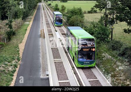 Two double decker buses on the guided busway between Cambridge and St. Ives. Stock Photo
