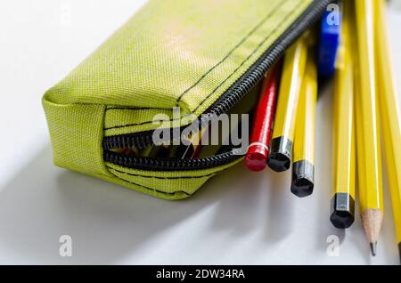 Close up of school supplies in pencil case on white background Stock Photo