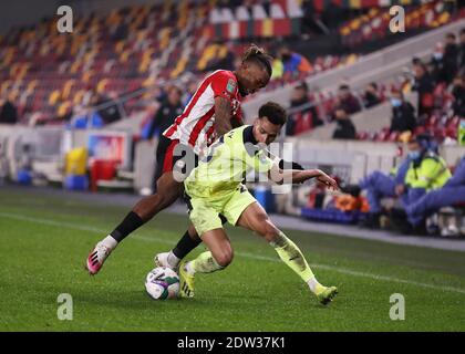 Brentford Community Stadium, London, UK. 22nd Dec, 2020. English Football League Cup Football, Carabao Cup, Brentford FC versus Newcastle United; Ivan Toney of Brentford challenges Jacob Murphy of Newcastle United Credit: Action Plus Sports/Alamy Live News Stock Photo