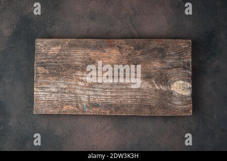 Background with wooden Board on concrete brown background. Stock Photo