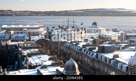 A very rare and cold winter scene over the Firth of Tay and Dundee city with snow covered rooftops and ice blanketing the river Tay in early January, UK Stock Photo