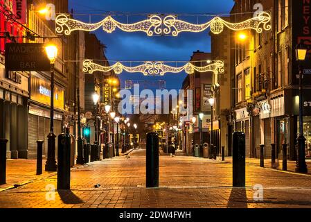 Dublin, Ireland - December 19, 2020: Christmas lights on empty Henry Street in the early morning during the COVID-19 lockdown Stock Photo