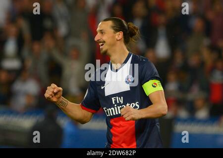 PSG's Zlatan Ibrahimovic joy after Lucas Moura scored the 3-0 goal during the French League One soccer match, PSG vs Montpellier in Paris, France, on May 17th, 2014. PSG won 4-0. Photo by Henri Szwarc/ABACAPRESS.COM Stock Photo