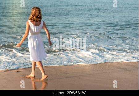 Mature woman enjoying herself on the beach Stock Photo - Alamy