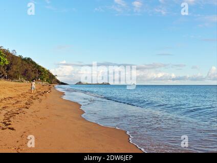 Early morning up Trinity Beach towards Palm Cove and the islands offshore on the northern beaches of Cairns QLD Australia Stock Photo