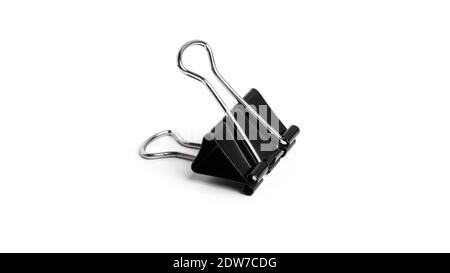 Black metal binder clips on white background. High quality photo Stock Photo