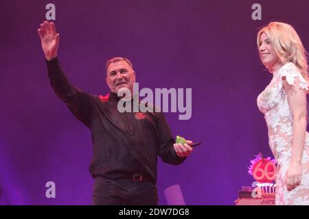 Jean-Marie Bigard with his wife Lola performs on stage for his one man show of 'Bigard fete ses 60 ans' held at Grand Rex in Paris, France, on May 23, 2014. Photo by Audrey Poree/ABACAPRESS.COM Stock Photo