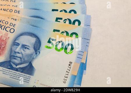 Mexican peso bills on a white background Stock Photo