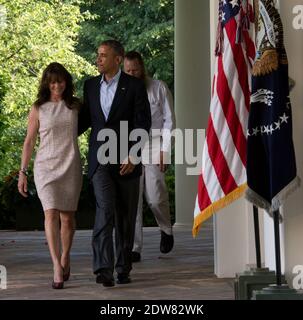 President Obama (center) walks with the parents of Sgt. Bowe Bergdahl, Jani Bergdahl (left) and Bob Bergdahl (right) from the Oval Office to make a statement regarding the release of Sgt. Bowe Bergdahl by the Taliban, Saturday May 31, 2014, in the Rose Garden at the White House in Washington, DC, USA. Photo by J.H. Owen/Pool/ABACAPRESS.COM Stock Photo