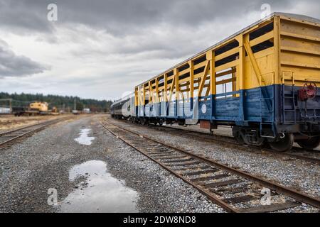 An empty train car sits on it's tracks at a railway station in Newport, Washington. Stock Photo