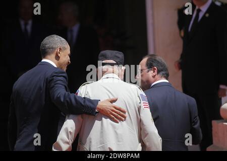 Barack Obama, President of the USA with an americain veteran and President Francois Hollande at Benouville Castle on June 6, 2014, during events to mark the 70th anniversary of the Allied landings in Normandy during World War II. World leaders and veterans gathered by the beaches of Normandy on to mark the 70th anniversary of the Allied landings in Normandy on D-Day during World War II. Photo by Denis Allard/Pool/ABACAPRESS.COM Stock Photo