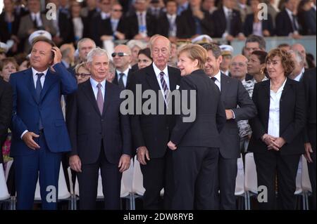 Former French presidents Valery Giscard d'Estaing and Nicolas Sarkozy , former French prime minister Edith Cresson and German Chancellor Angela Merkel.International D-Day commemoration ceremony in Ouistreham as part of the 70th anniversary of the World War Two D-Day landing, at Sword Beach, Ouistreham, Normandy, France, on June 06, 2014. Photo by Laurent Chamussy/Pool/ABACAPRESS.COM Stock Photo