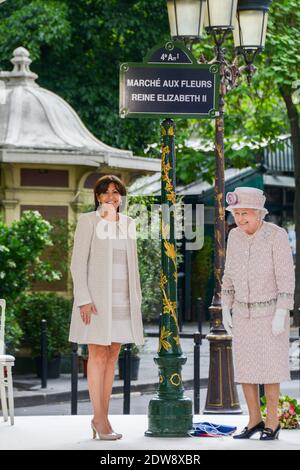 Anne Hidalgo Mayor of Paris (L) looks on as Queen Elizabeth II unveils a sign renaming Paris Flower Market on June 7, 2014 in Paris, France. The Queen is on the final day of a three day State Visit to Paris. The Flower Market was renamed 'Marche Aux Fleurs Reine Elizabeth II' in the Queen's Honour today. Photo by Ammar Abd Rabbo/ABACAPRESS.COM Stock Photo