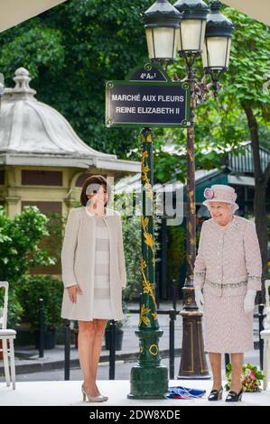 Anne Hidalgo Mayor of Paris (L) looks on as Queen Elizabeth II unveils a sign renaming Paris Flower Market on June 7, 2014 in Paris, France. The Queen is on the final day of a three day State Visit to Paris. The Flower Market was renamed 'Marche Aux Fleurs Reine Elizabeth II' in the Queen's Honour today. Photo by Ammar Abd Rabbo/ABACAPRESS.COM Stock Photo