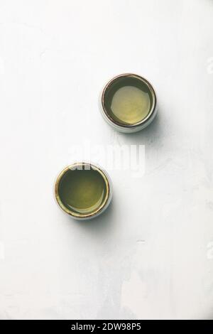 Tea composition, green tea on grey concrete background, flat lay Stock Photo